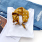Mustard Yellow polka dots mulberry silk neck scarf on a white shirt with blue jeans