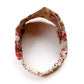 Natural Cotton Linen rose floral patterned headband on a white background.
