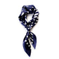 Navy blue silk scarf with white geometric pattern on a white background