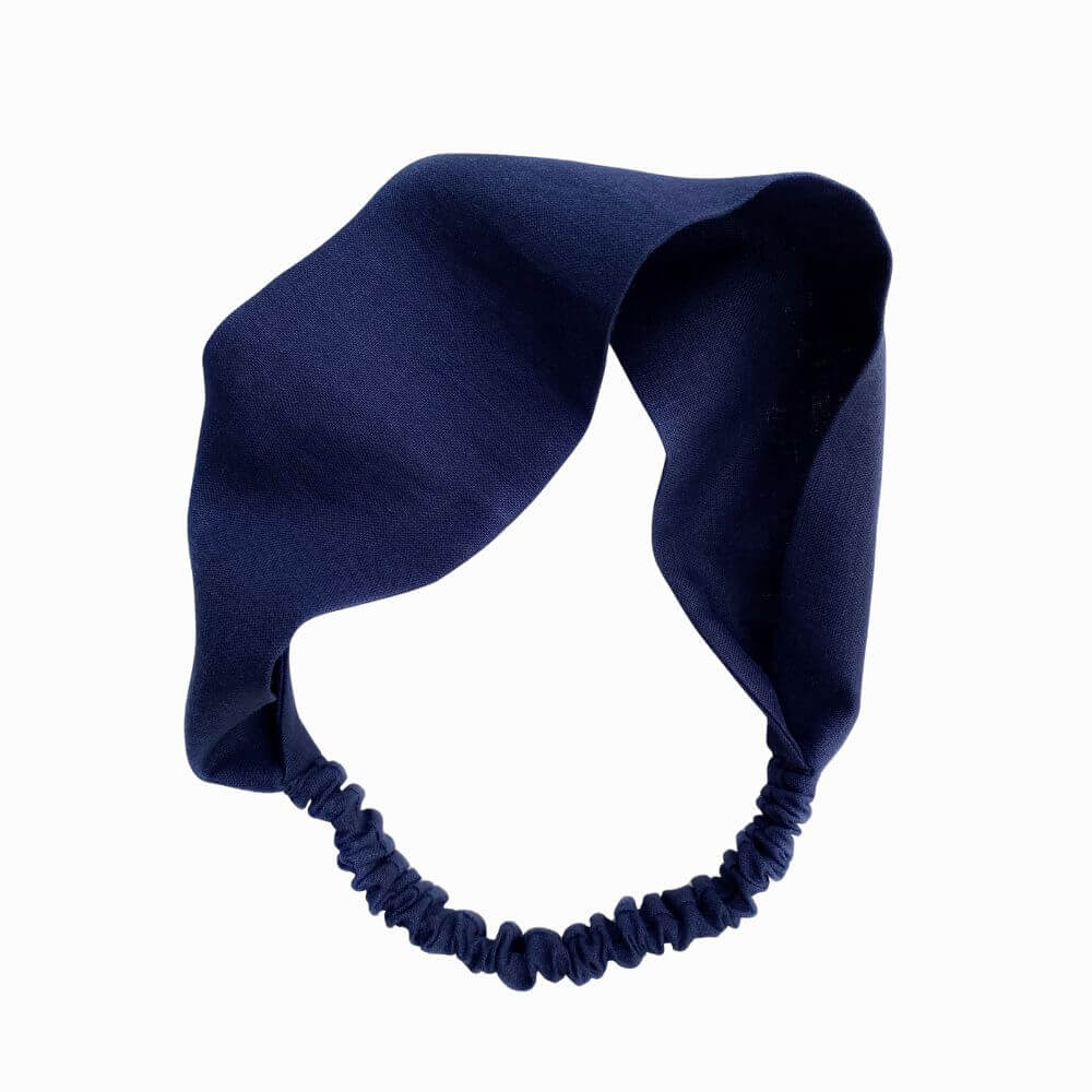 Navy blue headband on a white background