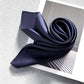 Navy blue silk scarf on a textured surface