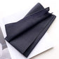 Folded navy blue and gray striped cotton bandana on a white background