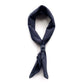 Navy striped scarf tied with a leather scarf clip on a white background