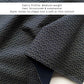 close up of a navy cotton bandana with japanese wave pattern and with the text shows that it is a Medium-weight fabric with a structured and substantial feel.