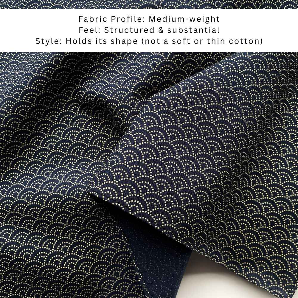 close up of a navy cotton bandana with japanese wave pattern and with the text shows that it is a Medium-weight fabric with a structured and substantial feel.