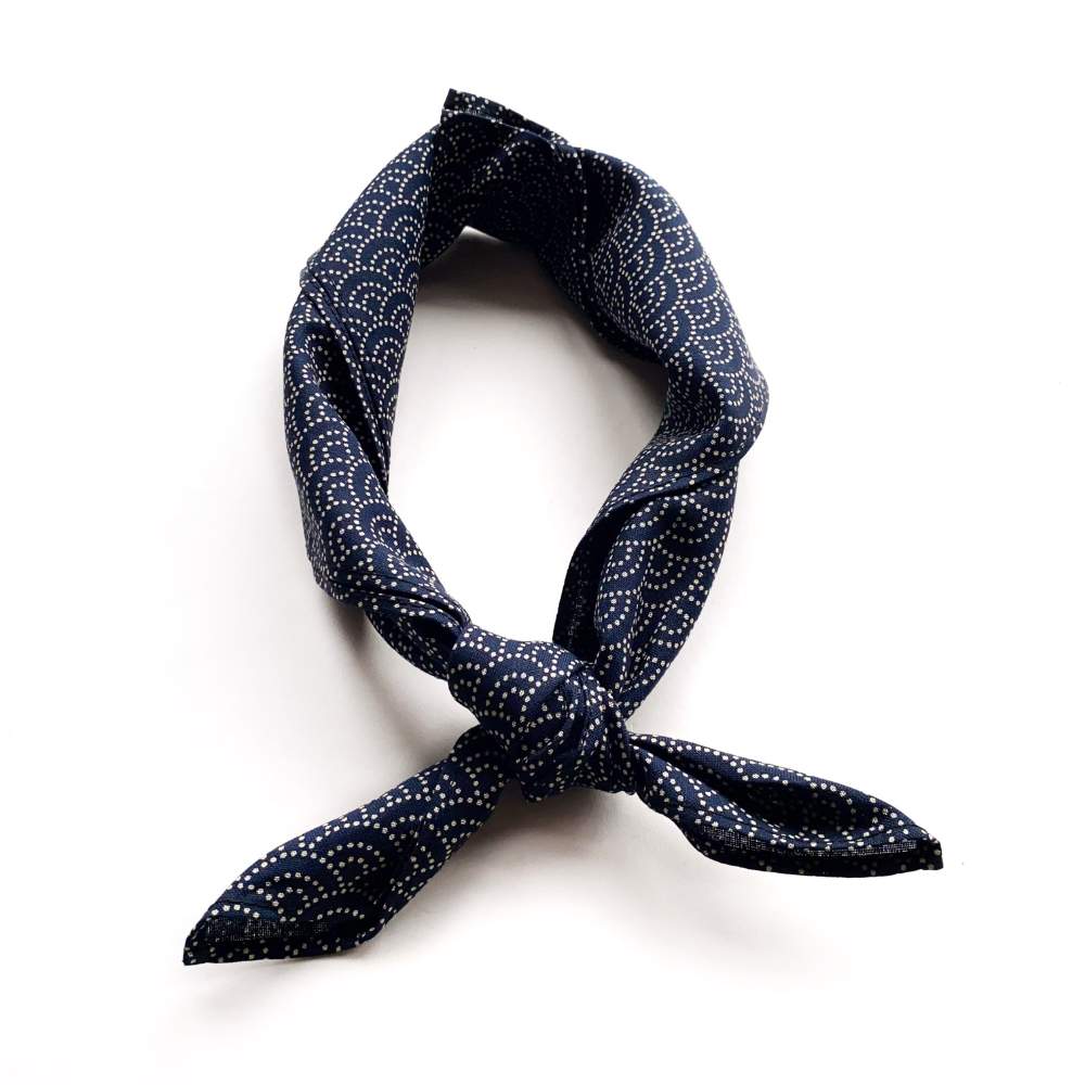 Navy blue wave patterned cotton bandana on a white background