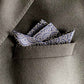 Navy blue Japanese cotton pocket square in a gray suit pocket