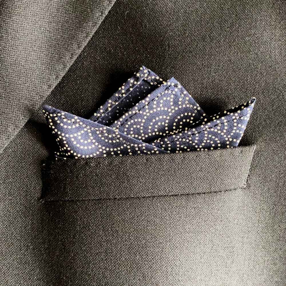 Navy blue Japanese cotton pocket square in a gray suit pocket