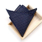 Navy wave print Japanese cotton pocket square in a wooden box on a white background
