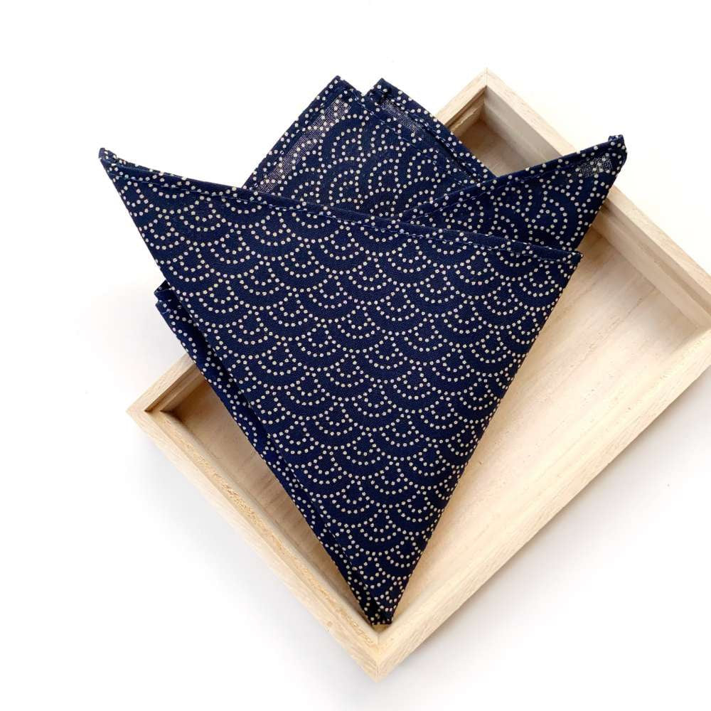 Navy wave print Japanese cotton pocket square in a wooden box on a white background