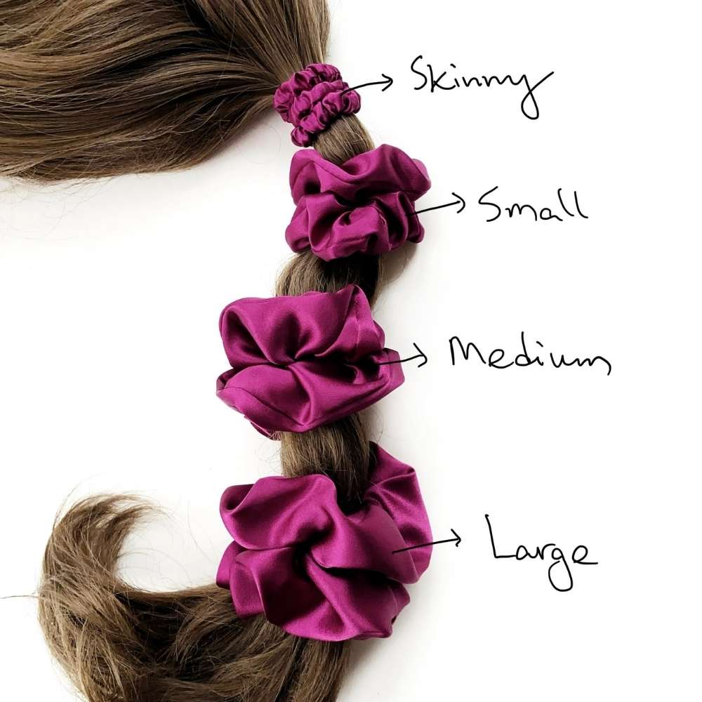 purple silk satin hair scrunchies of different sizes on a braid with labels