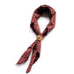 Red floral patterned scarf with a leather scarf clip on a white background