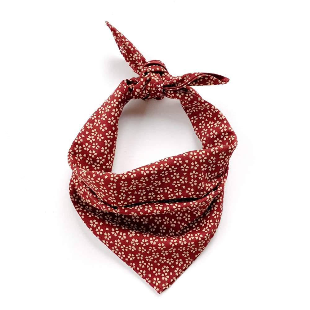 Red floral patterned bandana on a white background