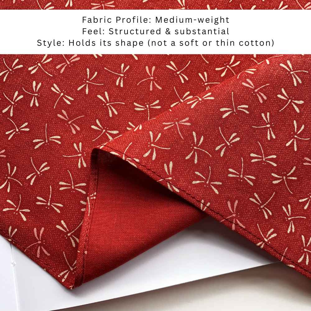 Close up red bandana with beige dragonfly pattern on a white background