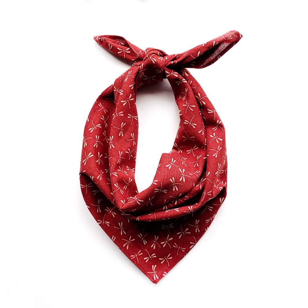 Red japanese cotton bandana with beige dragonfly patterns on a white background