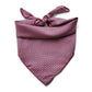 A deep red geometric and paisley print mulberry silk square scarf tied at the back, displayed on a white background
