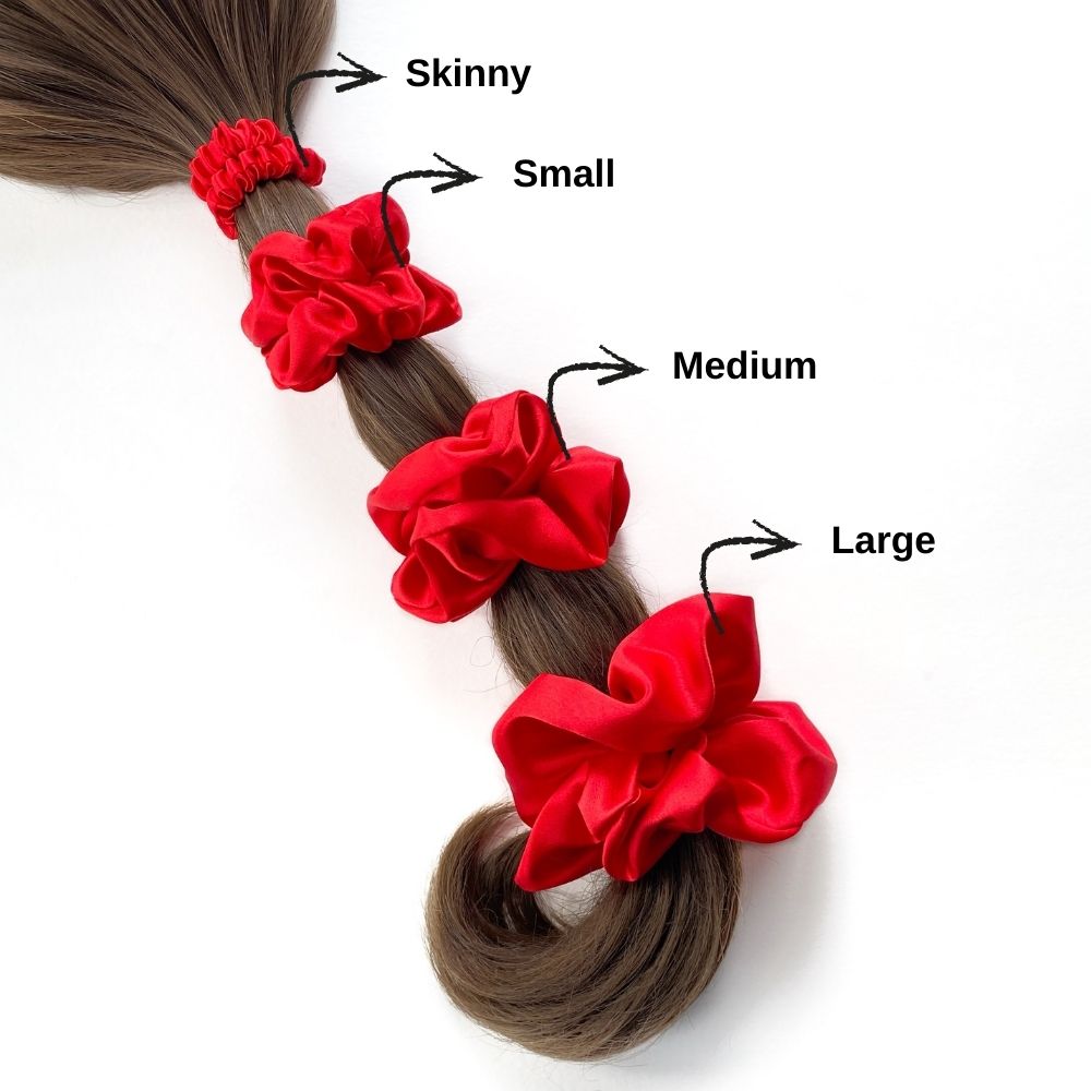 set of red mulberry silk satin scrunchies  and hair ties tied on the ponytail with size chat on a white background