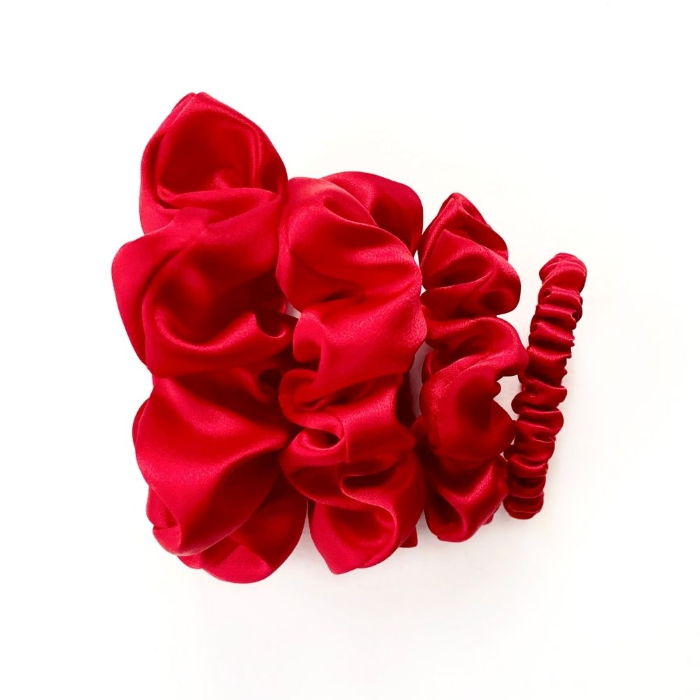 set of red mulberry silk satin scrunchies  and hair ties on the white background