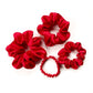 set of red mulberry silk satin scrunchies  and hair ties on the white background