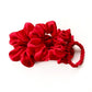 set of red mulberry silk satin scrunchies  and hair ties on the white background