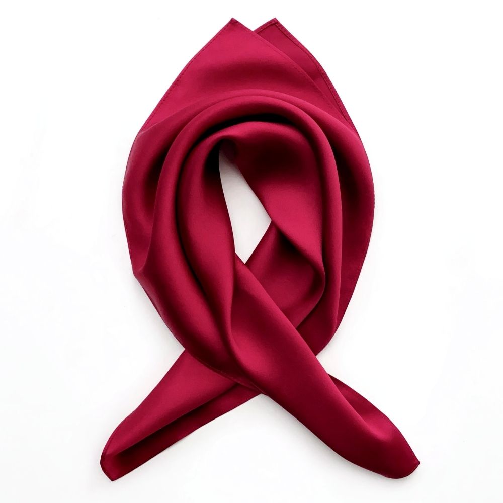 Berry red Mulberry silk satin square scarf arranged in a soft loop on white background