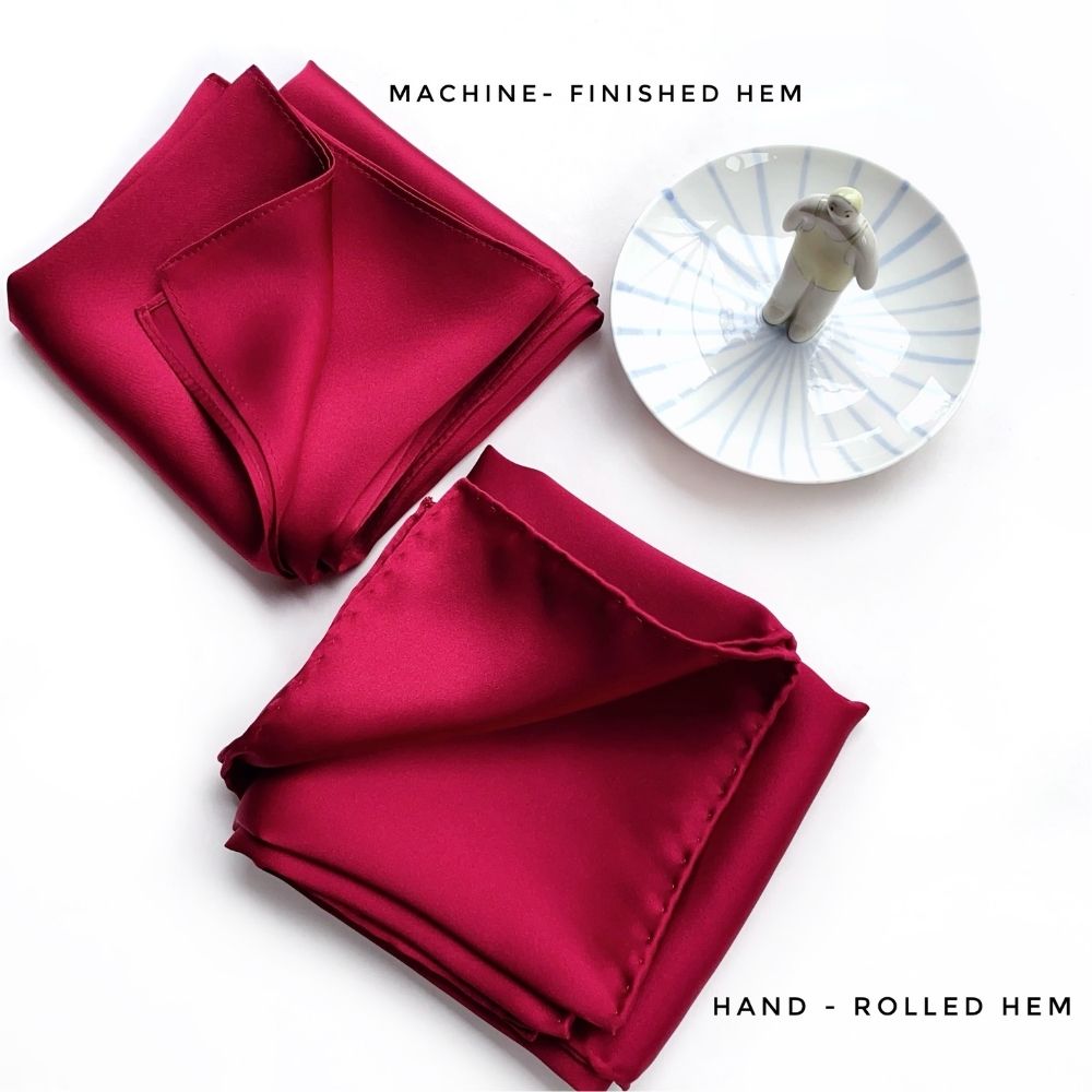 Berry red Mulberry silk satin squares showing machine-finished hem and hand-rolled hem