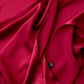 Close-up of berry red Mulberry silk satin fabric with smooth sheen