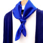 Royal blue silk scarf styled with a navy cardigan and white top