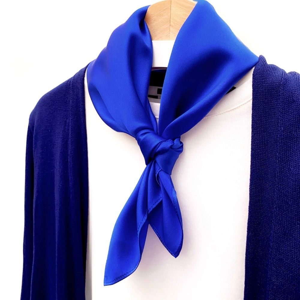 Royal blue silk scarf styled with a navy cardigan and white top