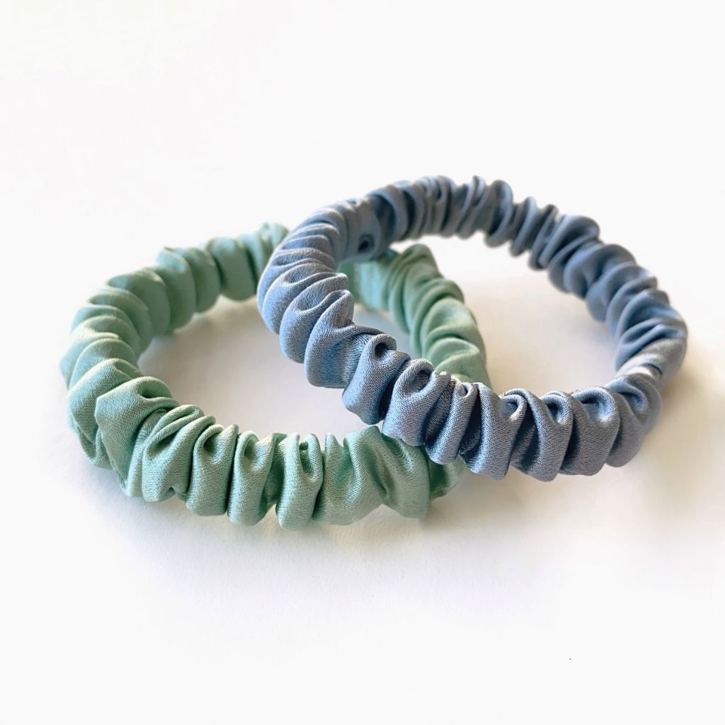 sage green and dusty blue mulberry silk skinny scrunchies and hair ties