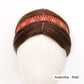 Red  cotton skinny headband with white patterns on a mannequin head against a white background