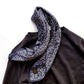 Dark purple mini-paisley Mulberry silk scarf styled on a brown sweater