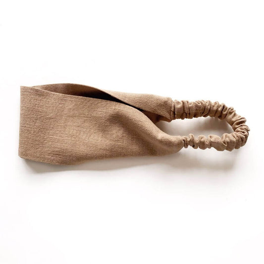 Taupe brown linen headband on a white background