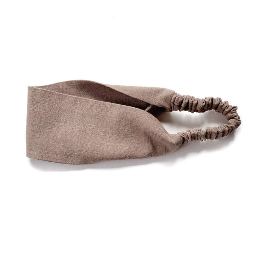 Brown linen headband on a white background