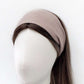 Brown linen headband worn by a mannequin head on a white background