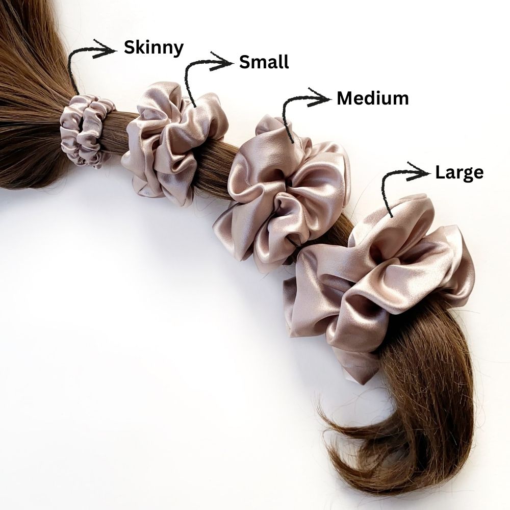 Set of four taupe mulberry silk satin scrunchies and hair ties on a ponytail with size labels.