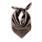 taupe brown silk scarf tied in a knot on a white background