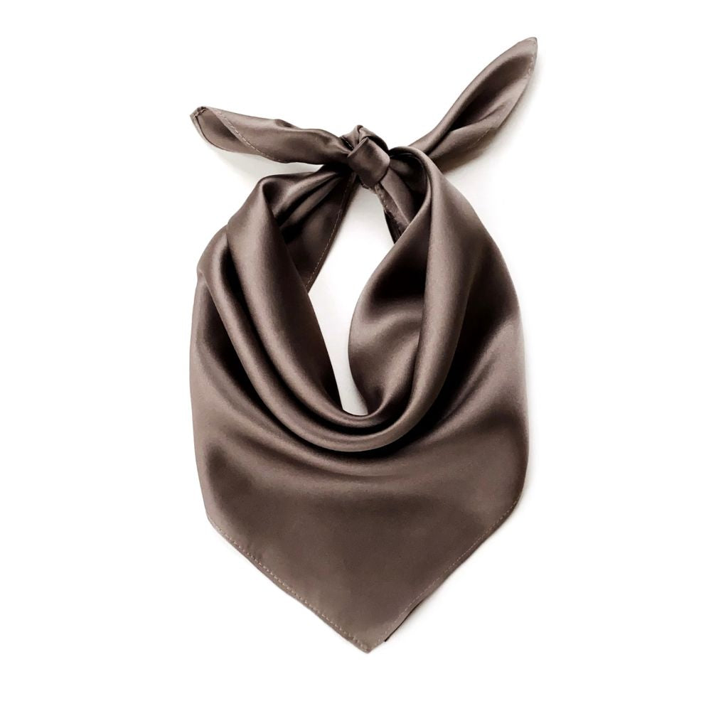 taupe brown silk scarf tied in a knot on a white background