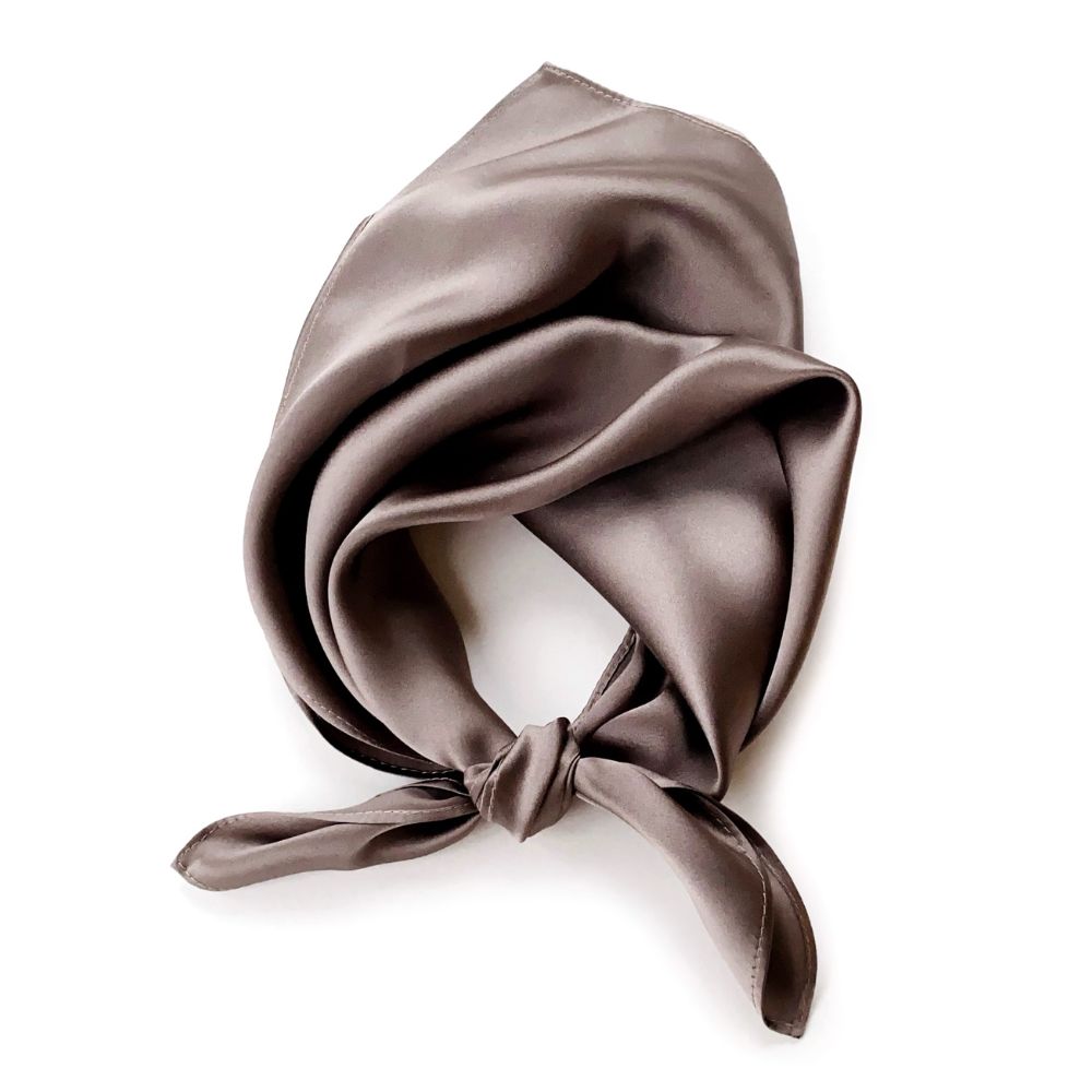 A taupe brown mulberry silk square scarf tied in a knot, displayed on a clean white background.