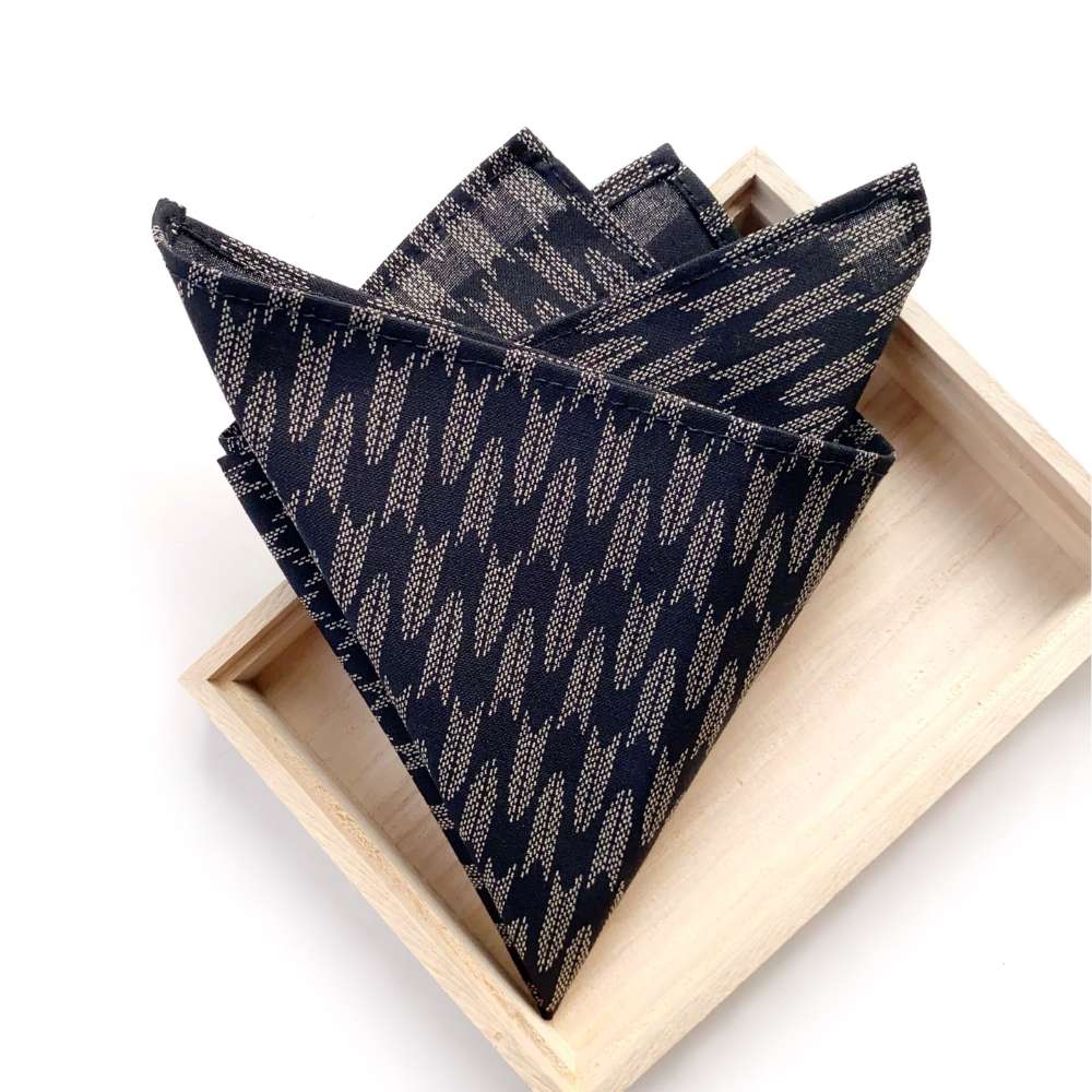 Black Japanese cotton pocket square in a wooden box on a white background